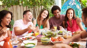 Friends-Enjoying-Meal-Outdoors_207645049-760x428